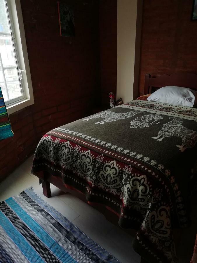 بانيوس Hostal La Casa Amarilla City المظهر الخارجي الصورة